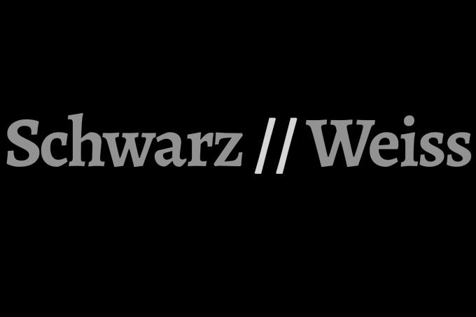 Die Schrift Schwarz//Weiss in grauer auf schwarzem Grund